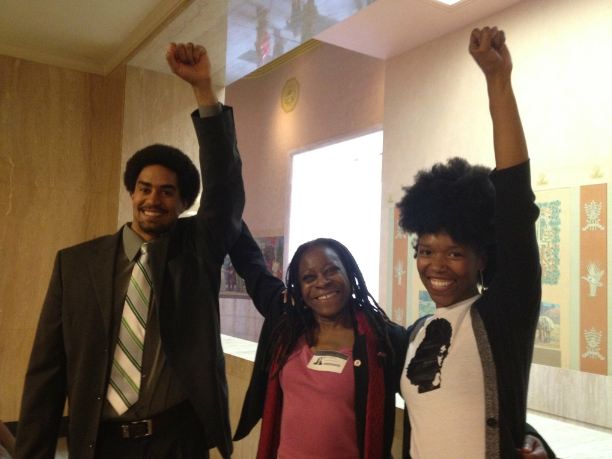 Purcell (center) with an Urban League staffer and Portland resident